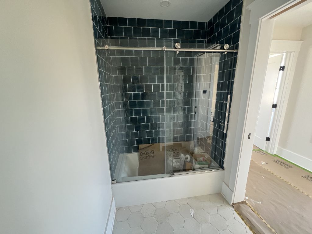 Sliding glass shower door installation complete