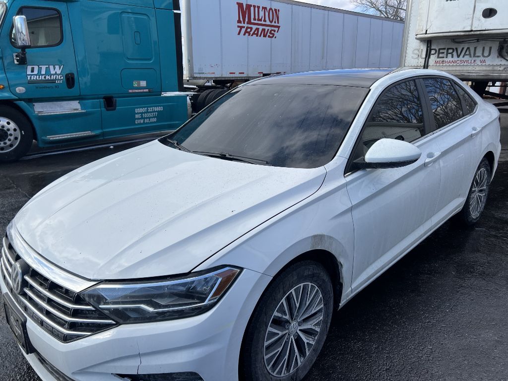 VW Jetta auto glass replacement at commercial fleet yard